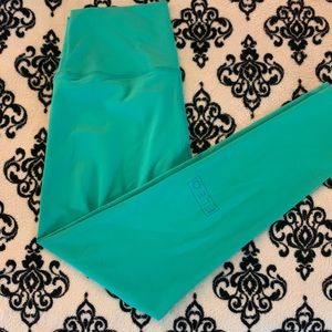 Fleo Janus peacock leggings